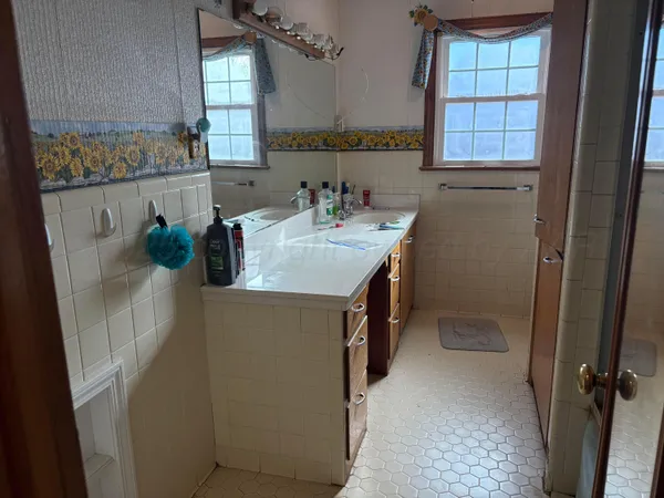 a bathroom with a sink and mirror