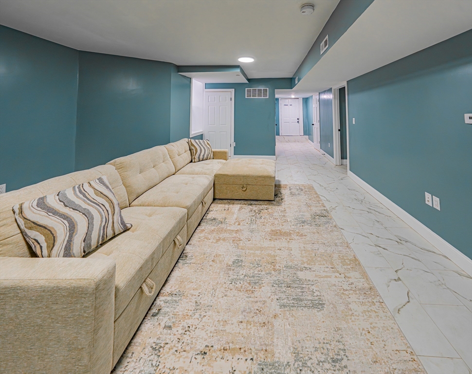 24 Tudor Street Chelsea, MA 02150 - Photo 15 of 36 a bed room with a bed