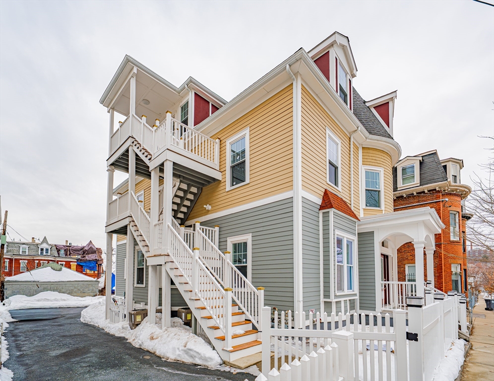 24 Tudor Street Chelsea, MA 02150 - Photo 2 of 36 a front view of a house with a yard