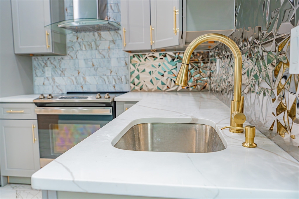 24 Tudor Street Chelsea, MA 02150 - Photo 25 of 36 a close view of sink and tap