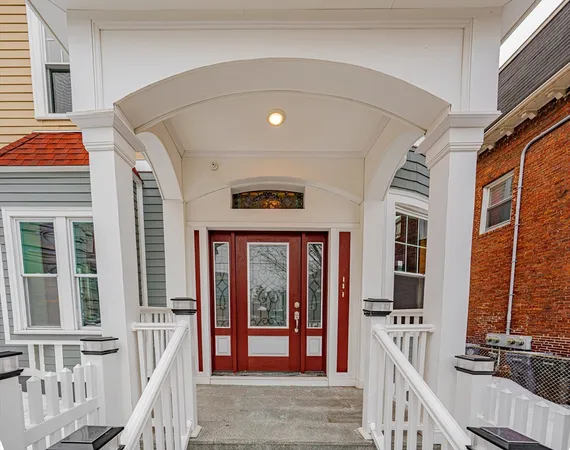 a view of front door of house with stairs