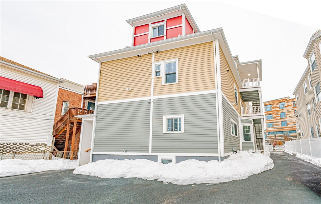 24 Tudor Street Chelsea, MA 02150 - Photo 36 of 36 a view of a house with a garage