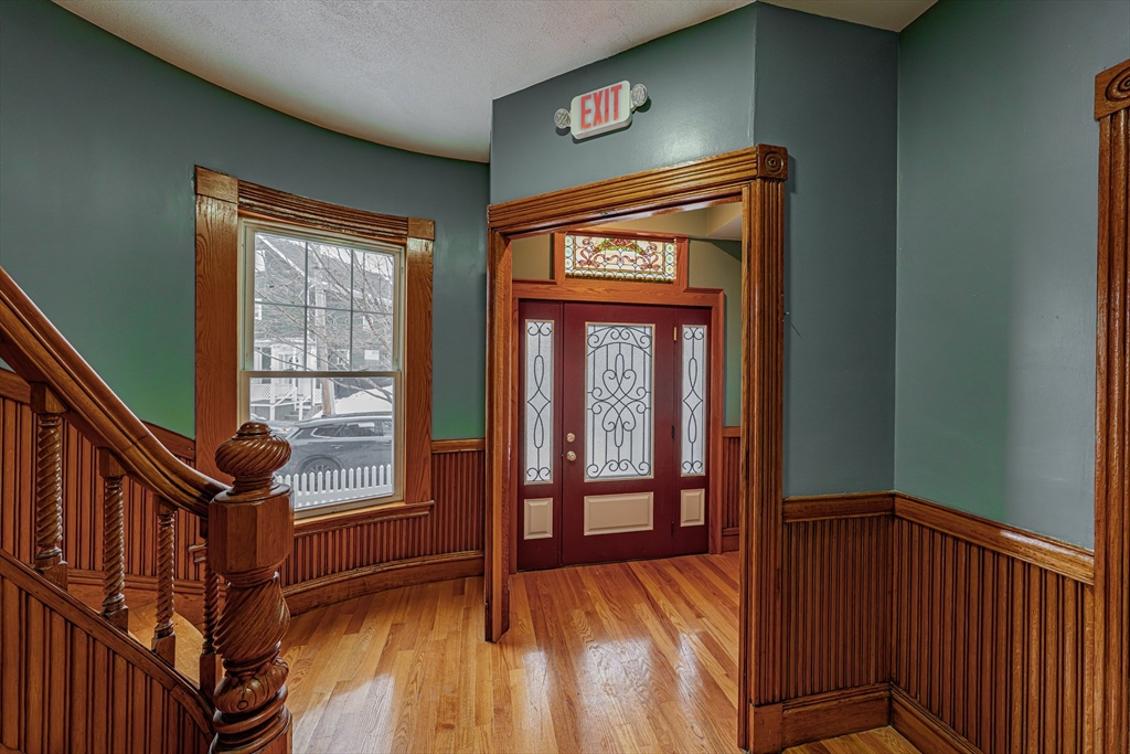 24 Tudor Street Chelsea, MA 02150 - Photo 4 of 36 a view of front door with a balcony