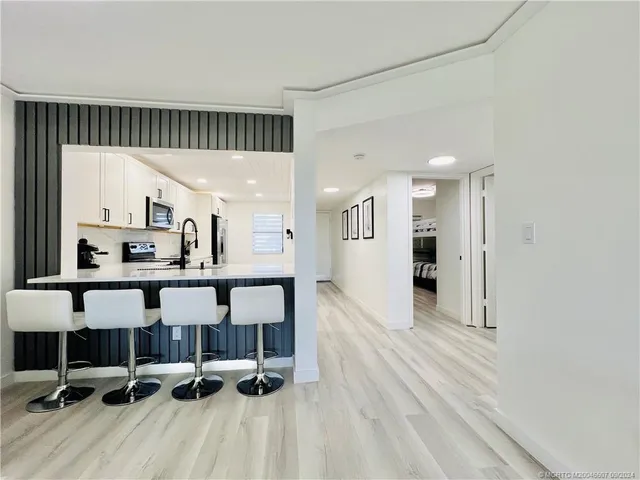 a living room with a flat screen tv and a fireplace