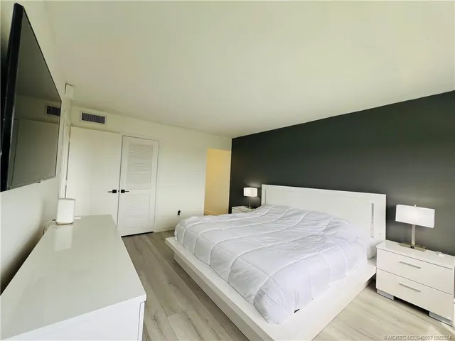 a bathroom with a shower a toilet and a sink