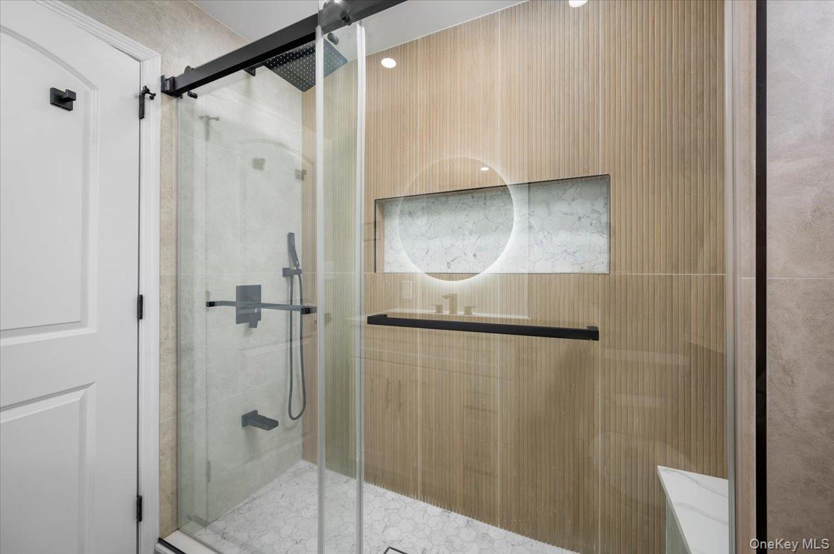 28 Cross Street Bronxville, NY 10708 - Photo 19 of 34 a bathroom with a shower
