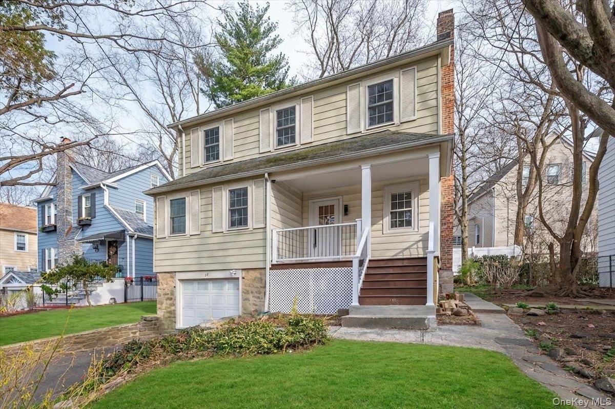 28 Cross Street Bronxville, NY 10708 - Photo 2 of 34 a front view of a house with a yard