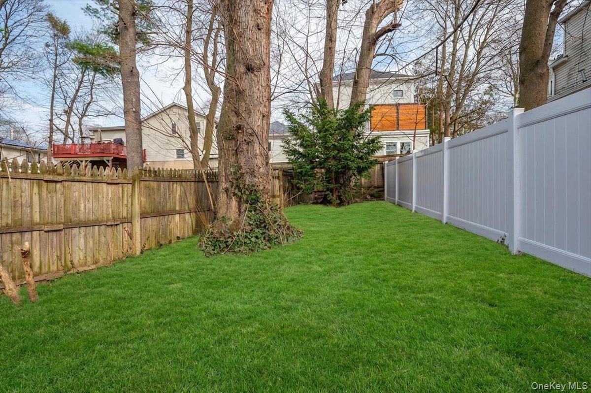28 Cross Street Bronxville, NY 10708 - Photo 27 of 34 a backyard of a house with lots of green space