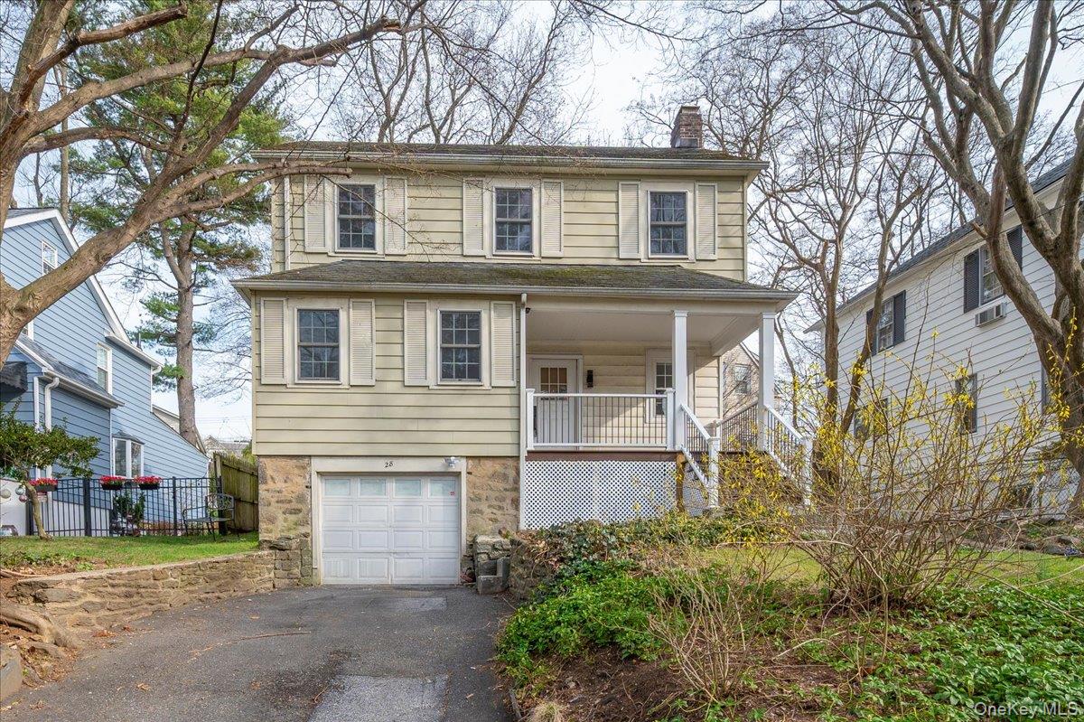 28 Cross Street Bronxville, NY 10708 - Photo 3 of 34 a front view of a house with a yard