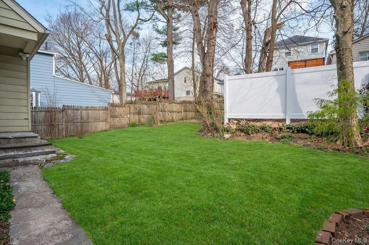 28 Cross Street Bronxville, NY 10708 - Photo 29 of 34 a view of a back yard with green space