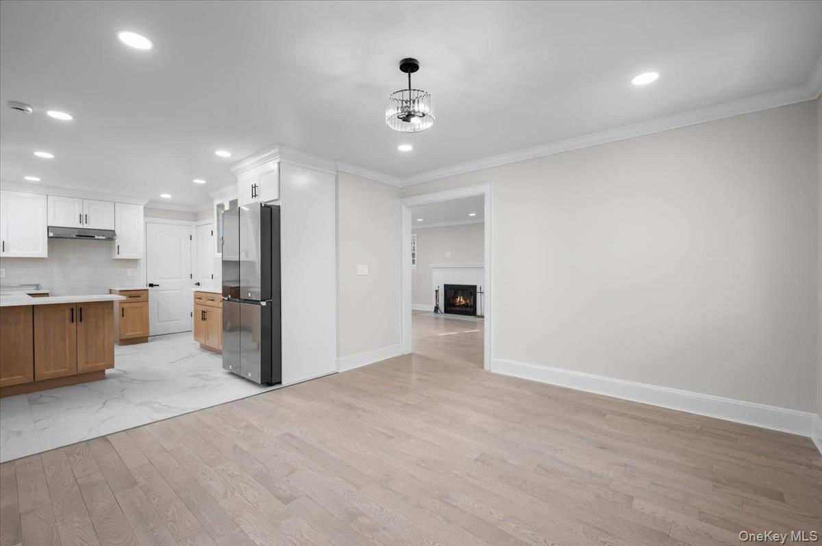 28 Cross Street Bronxville, NY 10708 - Photo 10 of 34 a view of a kitchen with a refrigerator and a sink