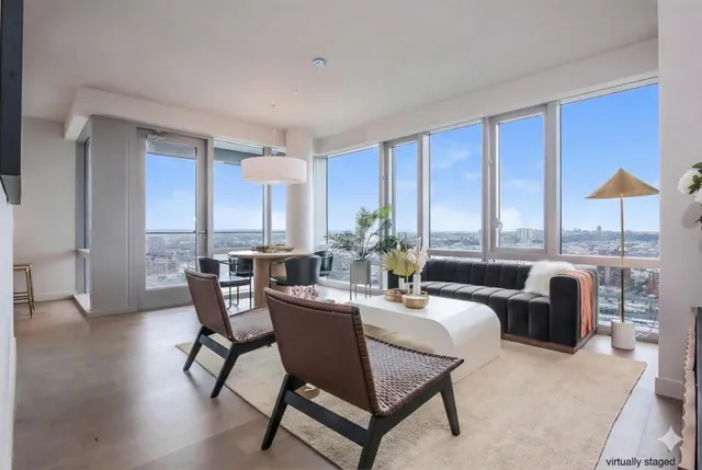 a dining room with furniture a window and a kitchen view
