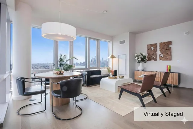 a living room with furniture a window and a table