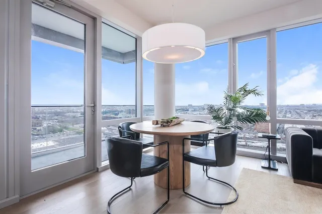a view of a dining room with furniture window and wooden floor