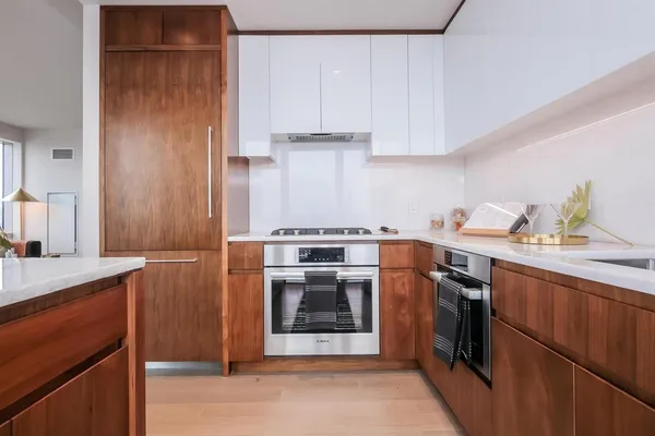 a kitchen with a stove and a sink