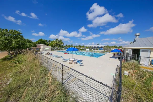 a view of swimming pool from a balcony