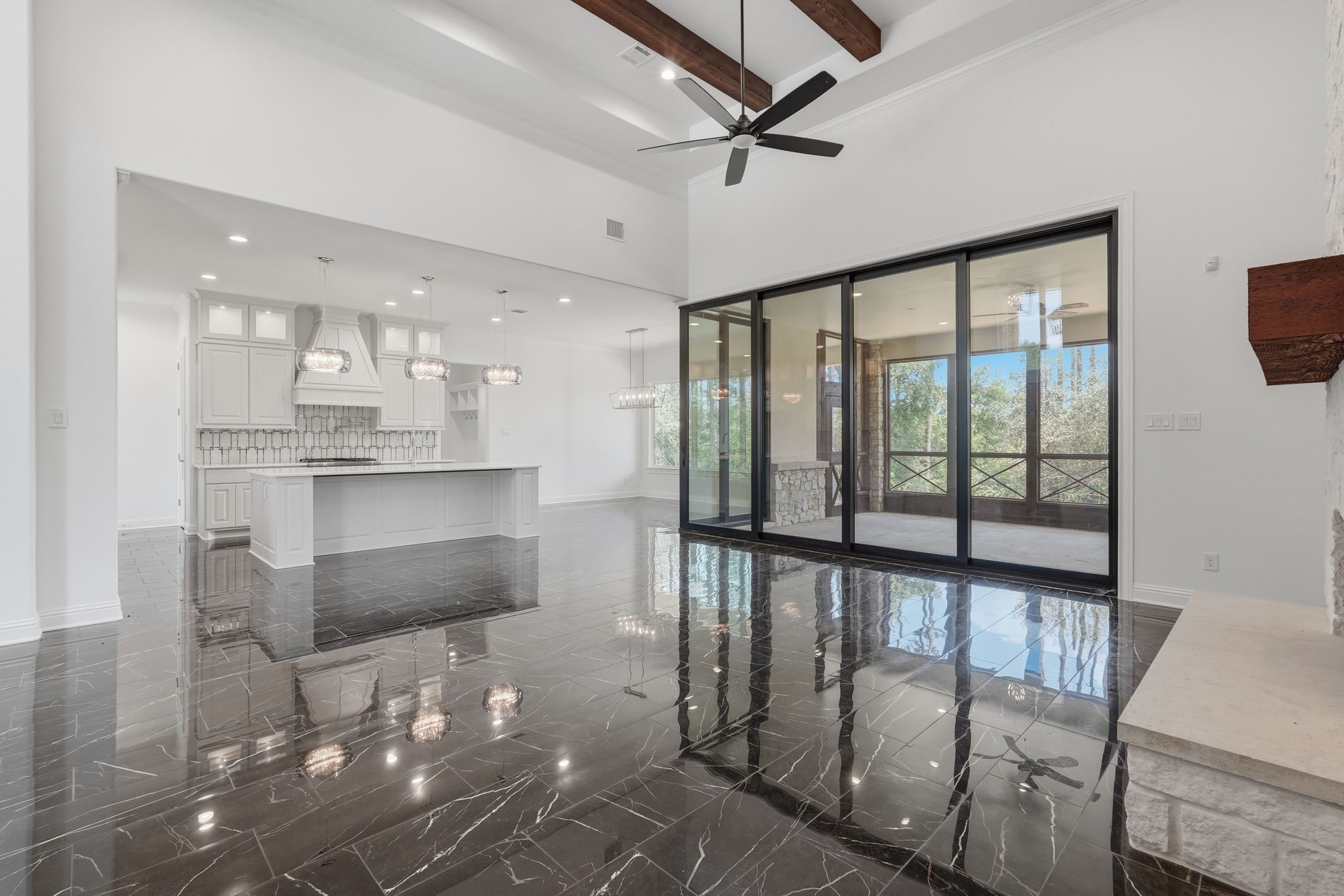 16081 Forest Mill Road Willis, TX 77378 - Photo 11 of 37 Designed for gathering, the open living and kitchen spaces offer stunning sightlines and a seamless flow throughout the home.