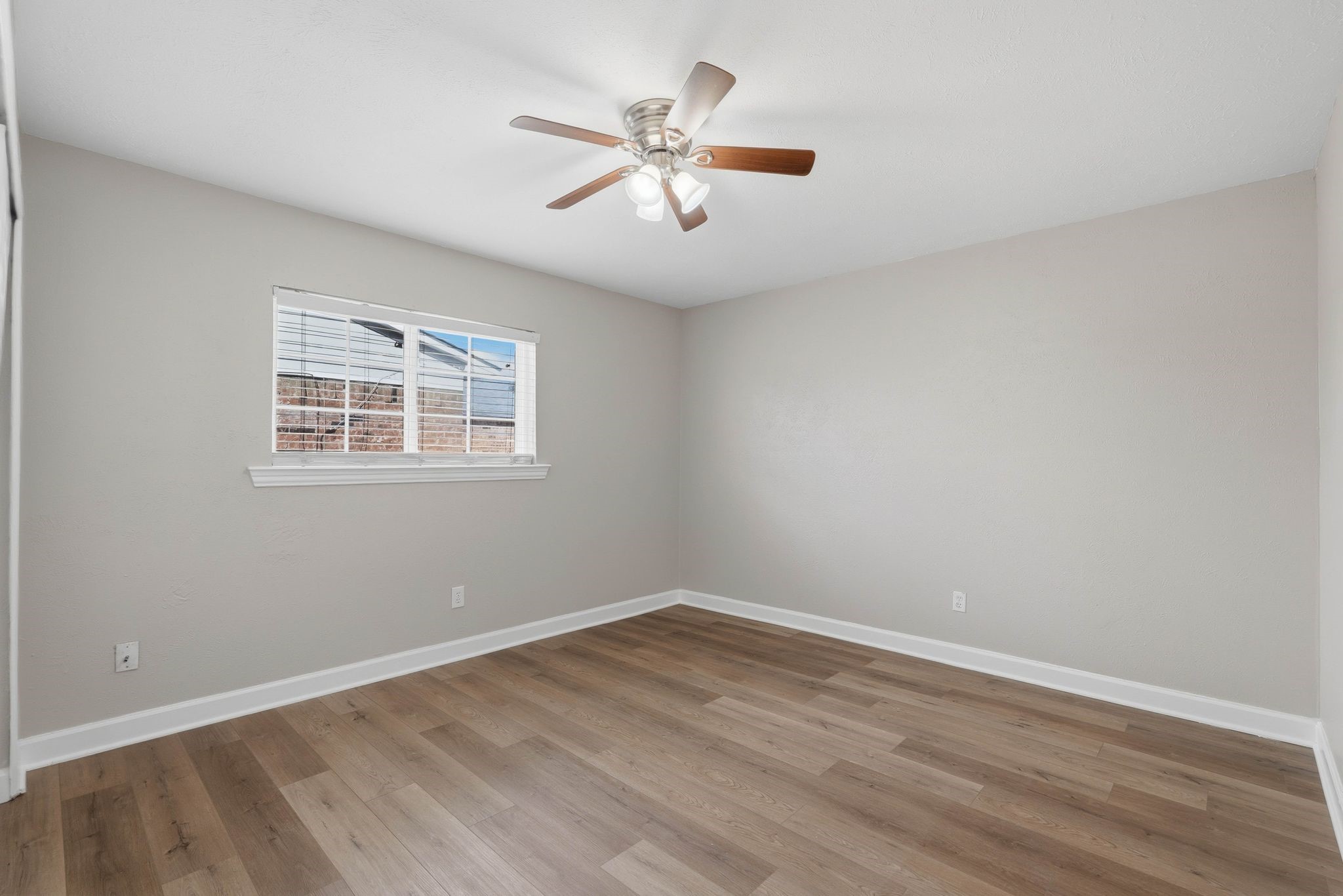 17223 Ranch Country Road Hockley, TX 77447 - Photo 21 of 36 Next up is bedroom number two with more bright light, neutral paint throughout, and easy to clean flooring. Notice, this home has no carpet throughout making it easy to maintain.