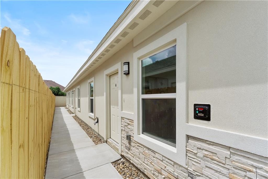 5323 Vision Street Rio Grande City, TX 78582 - Photo 3 of 16 View of property exterior featuring stone siding and stucco siding
