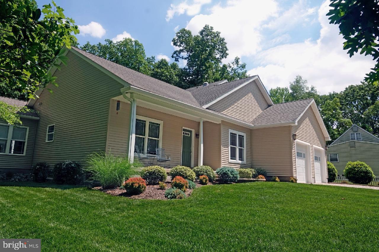606 Old Indian Mills Road Tabernacle, NJ 08088 - Photo 1 of 43 a front view of a house with a garden and plants