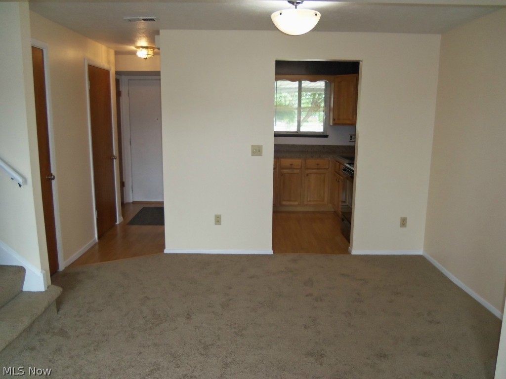 8955 West Ridge Road, Unit C Elyria, OH 44035 - Photo 8 of 24 New lighting fixture in the Dining Room with new carpet.