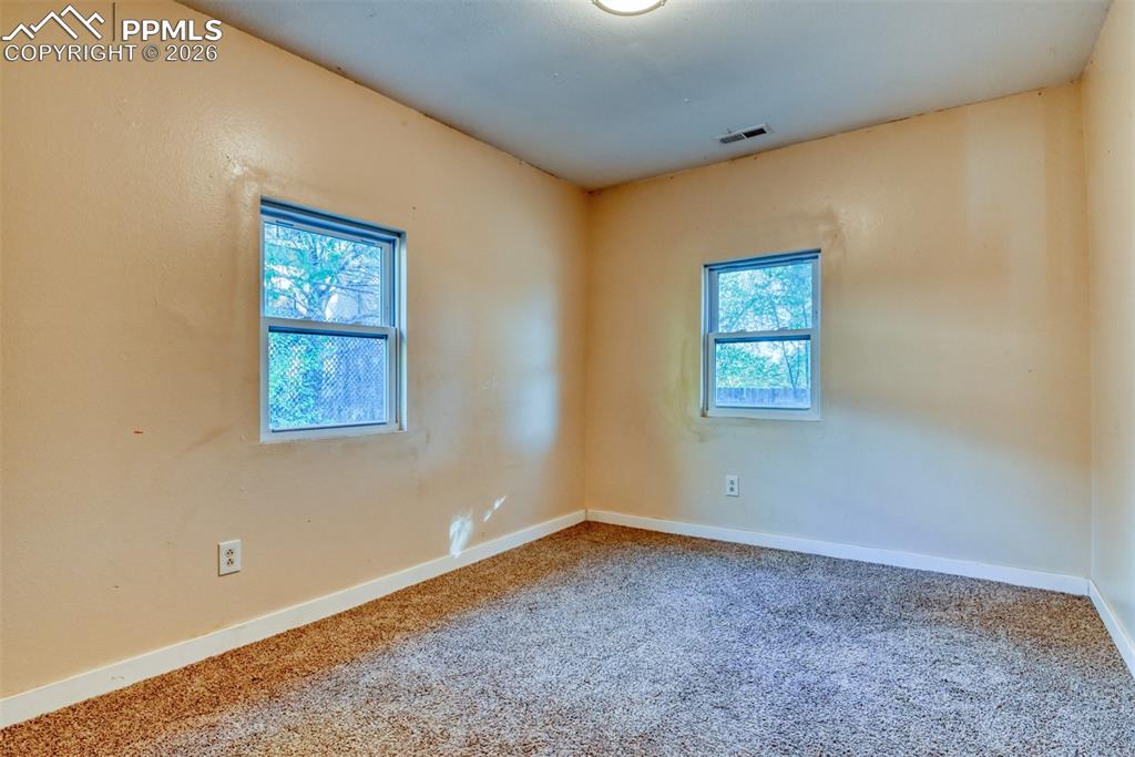 632 Santa Fe Street Colorado Springs, CO 80903 - Photo 15 of 24 an empty room with windows