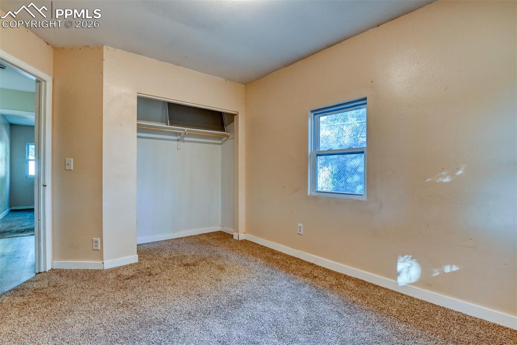 632 Santa Fe Street Colorado Springs, CO 80903 - Photo 16 of 24 a view of an empty room with closet and entryway