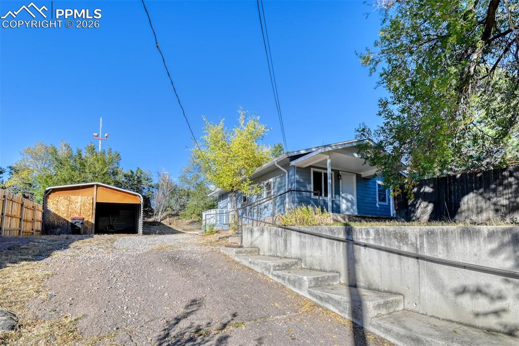 632 Santa Fe Street Colorado Springs, CO 80903 - Photo 3 of 24 a view of a house with a yard