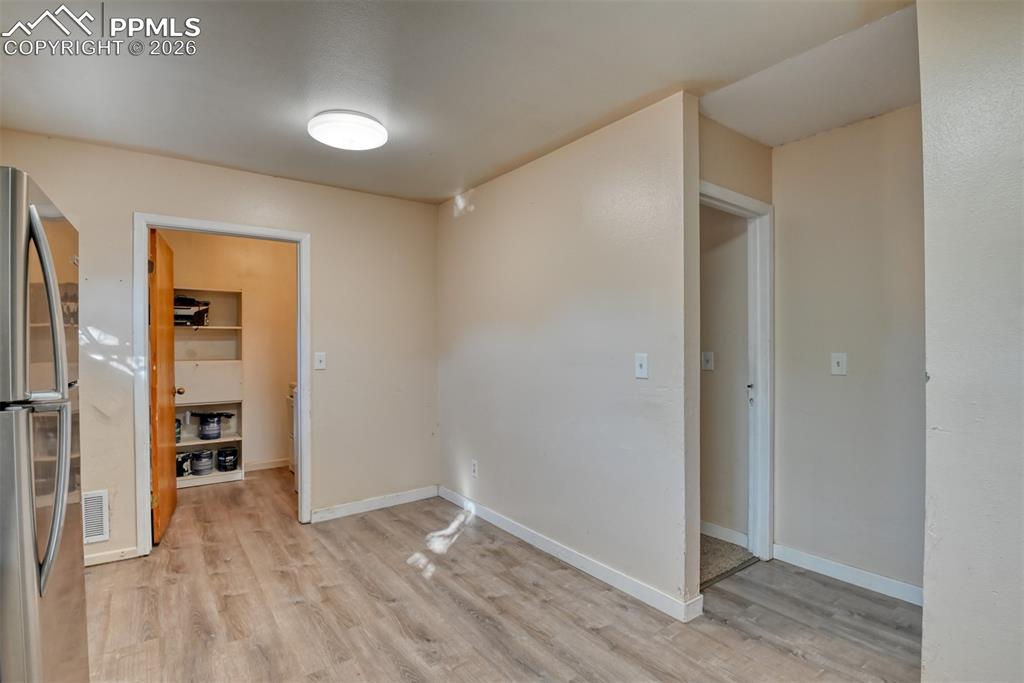 632 Santa Fe Street Colorado Springs, CO 80903 - Photo 6 of 24 a view of empty room with wooden floor