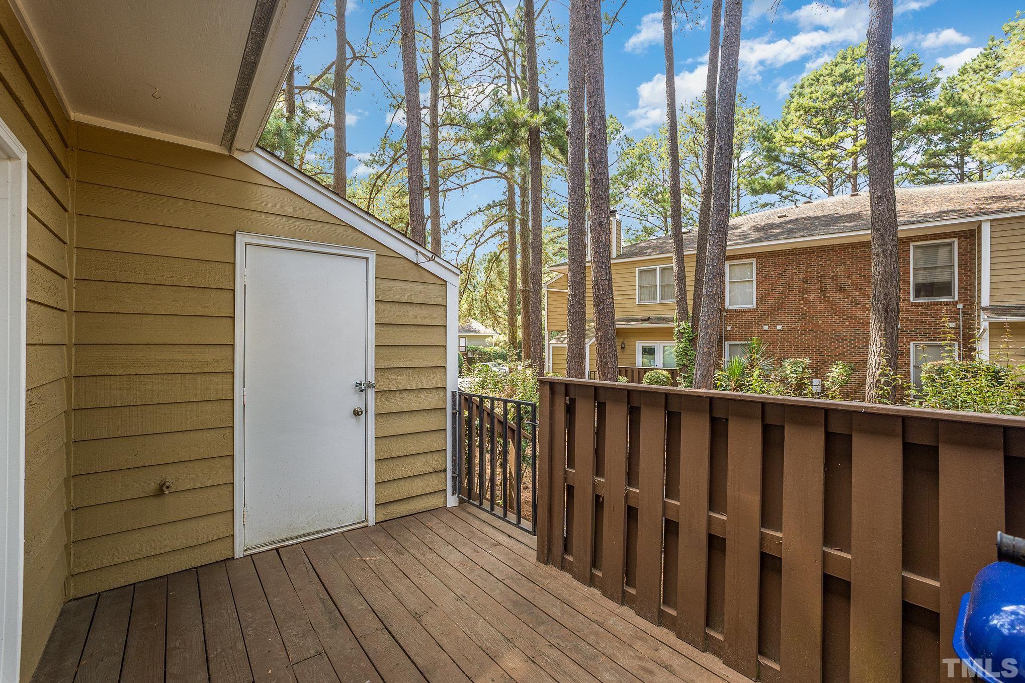 3219 Mill Run, Unit 175 Raleigh, NC 27612 - Photo 15 of 16 a view of wooden balcony