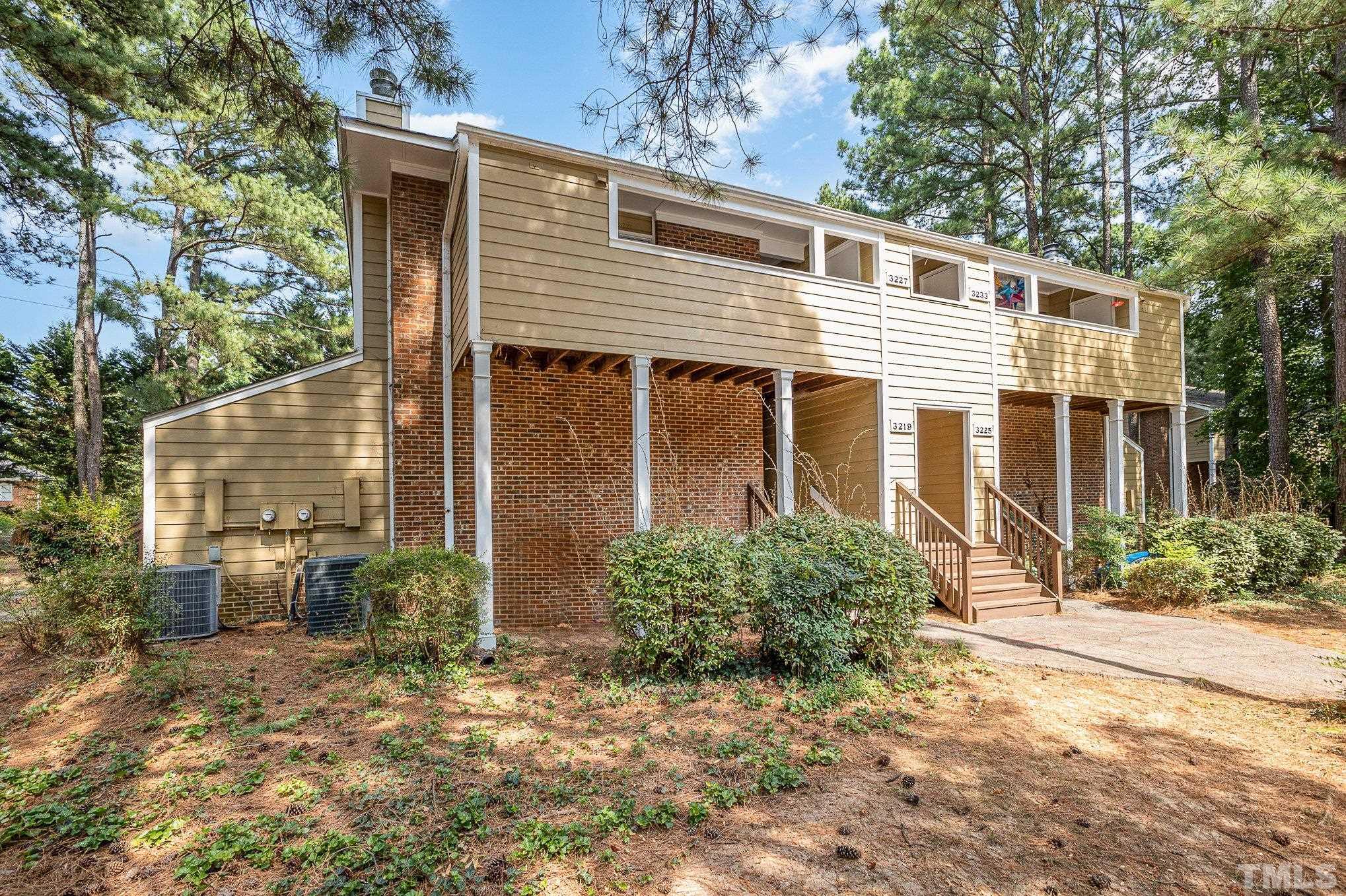 3219 Mill Run, Unit 175 Raleigh, NC 27612 - Photo 3 of 16 a view of a house with backyard