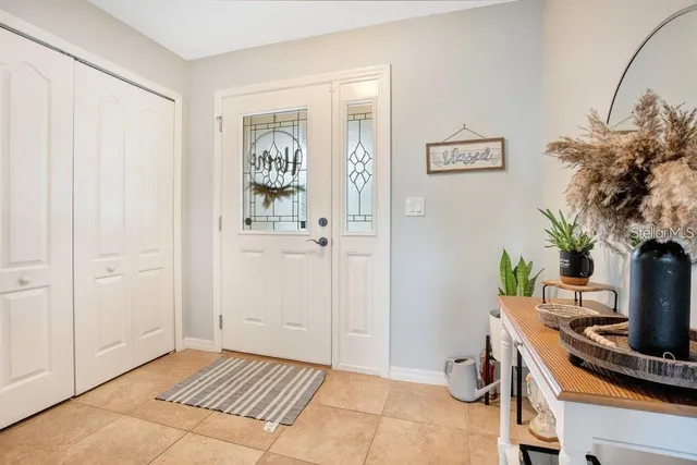 a view of workspace with furniture and flat screen tv