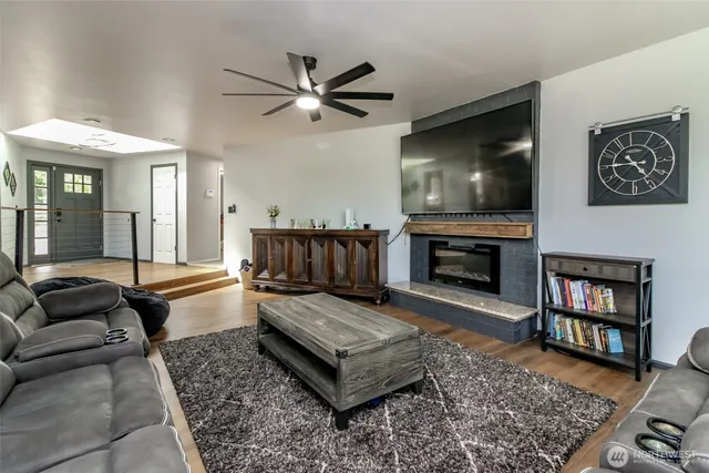 a dining room with furniture and wooden floor