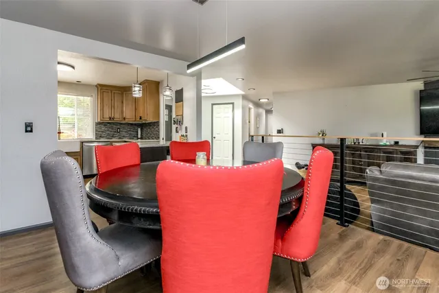 a kitchen with granite countertop a sink refrigerator and cabinets