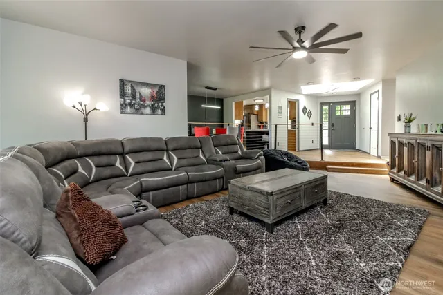 a living room with furniture and a rug
