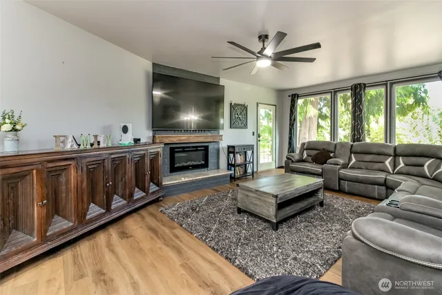 a living room with furniture and a flat screen tv