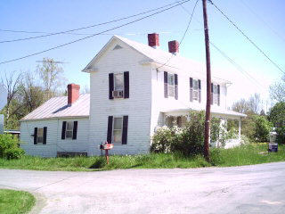 11 West Wolfe Ridge Road Bridgewater, VA 22812 - Photo 1 of 1 a front view of a house with a yard and potted plants
