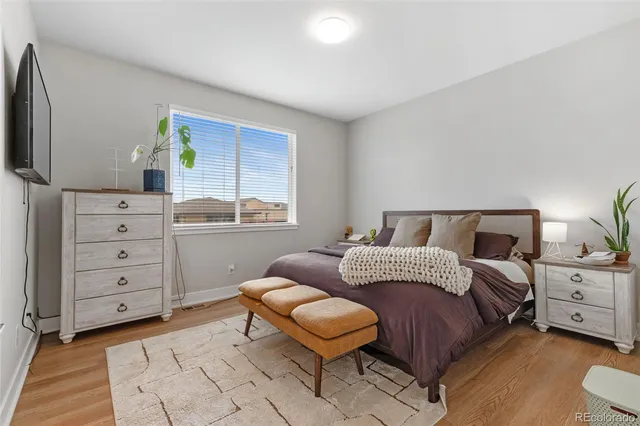 a bedroom with a bed and a dresser