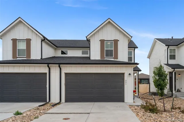 a front view of a house with a garage