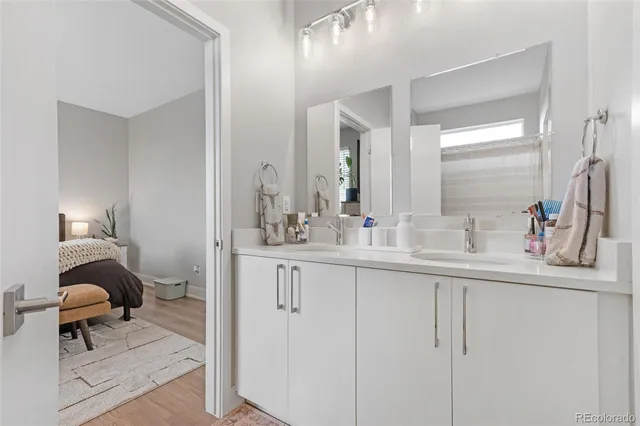 a en suite bathroom with a sink and a mirror