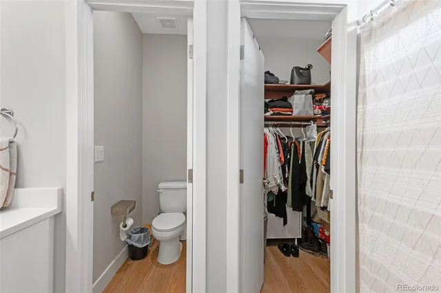 a view of a storage and utility room with washer and dryer