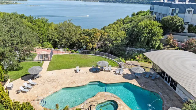 a view of a swimming pool and lounge chair