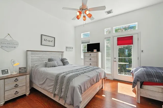 a bedroom with a large bed and a window