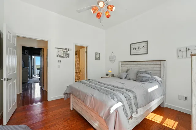 a bedroom with a bed and a chandelier