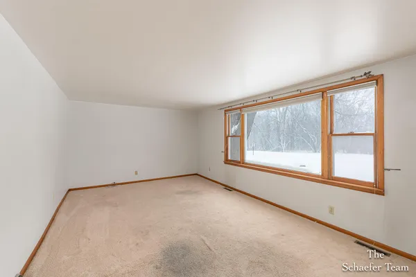 $338,000 | 4885 Gavin Lake Road Northeast, Ada, MI 49301