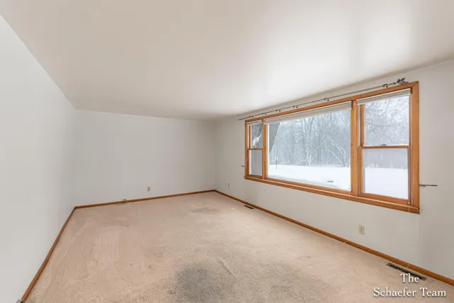 $350,000 | 4885 Gavin Lake Road Northeast, Ada, MI 49301