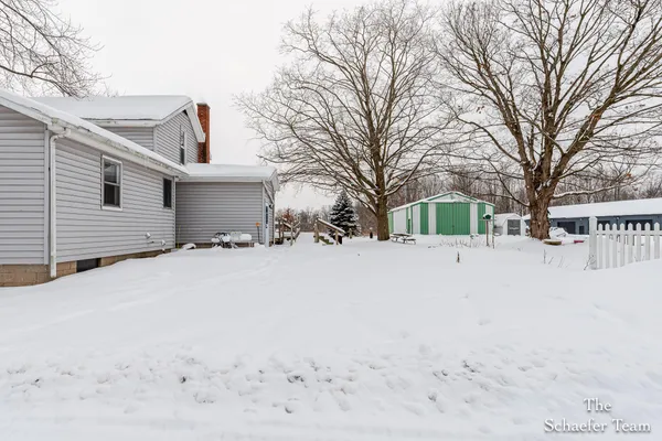 $338,000 | 4885 Gavin Lake Road Northeast, Ada, MI 49301