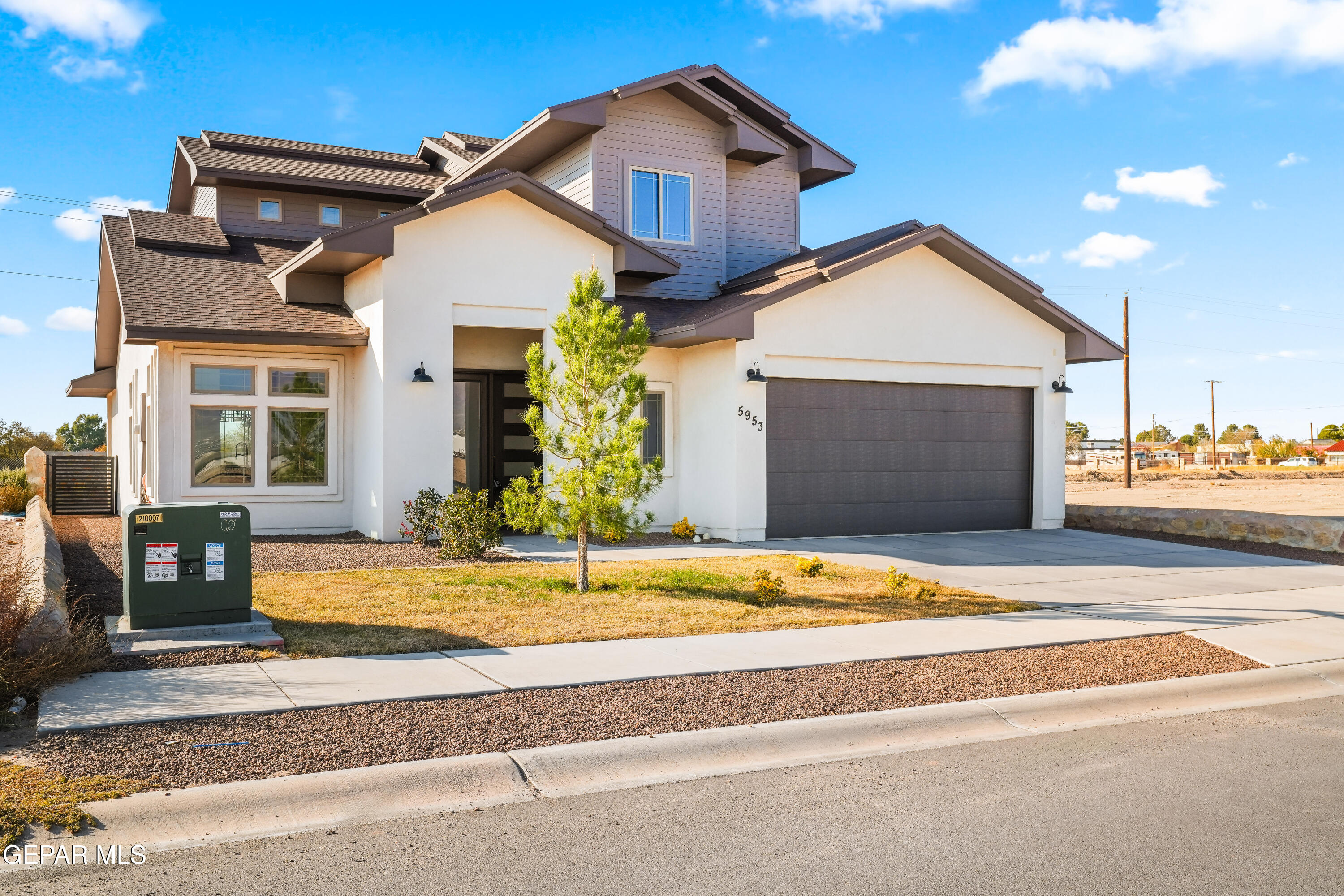 5953 Ruidoso Downs Street El Paso, TX 79932 - Photo 2 of 56 a view of a house with a yard and potted plants
