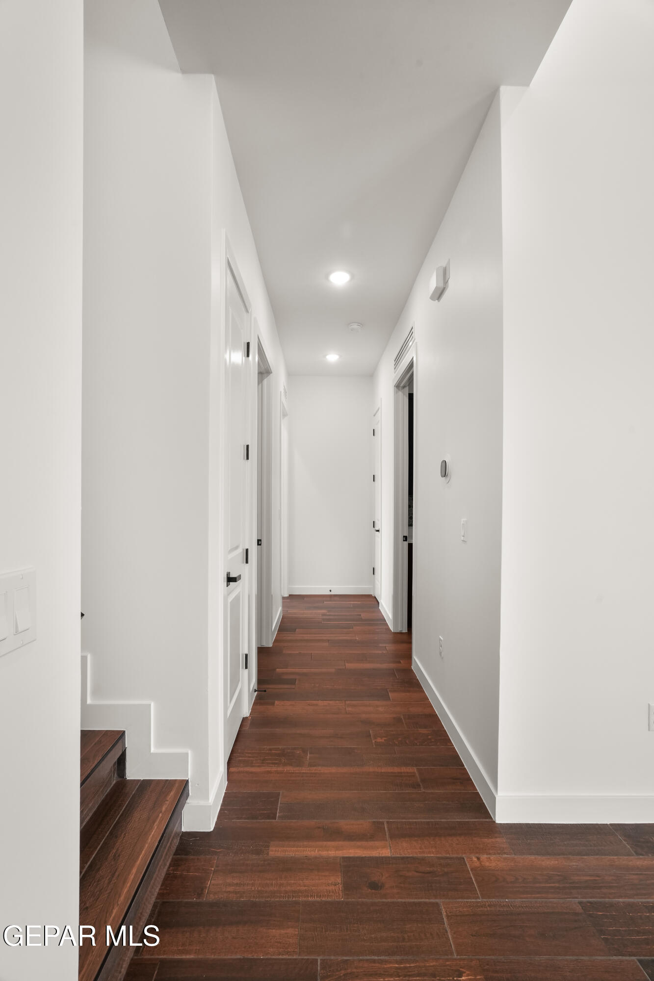 5953 Ruidoso Downs Street El Paso, TX 79932 - Photo 22 of 56 a view of a hallway with wooden floor