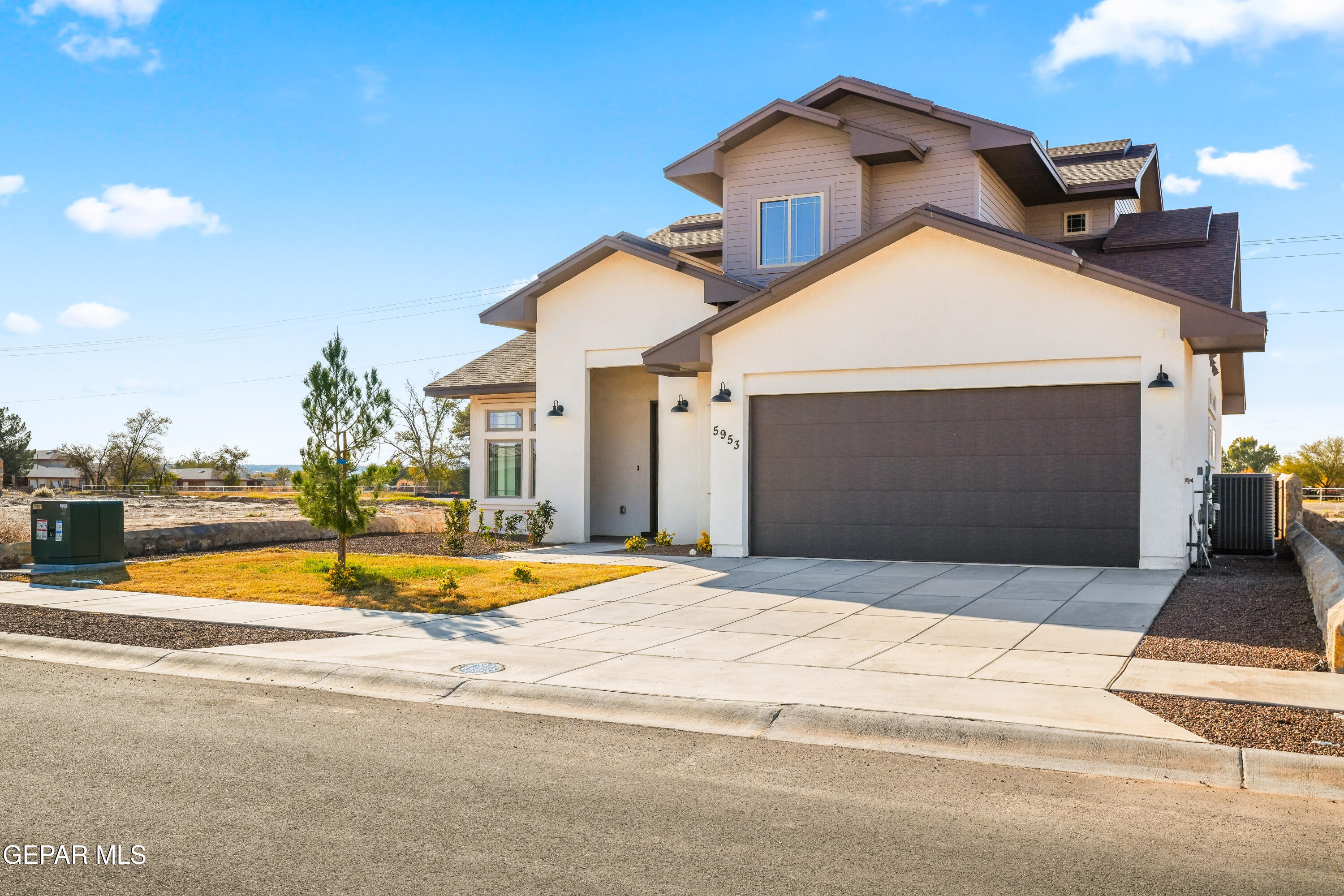 5953 Ruidoso Downs Street El Paso, TX 79932 - Photo 3 of 56 a front view of a house with a yard
